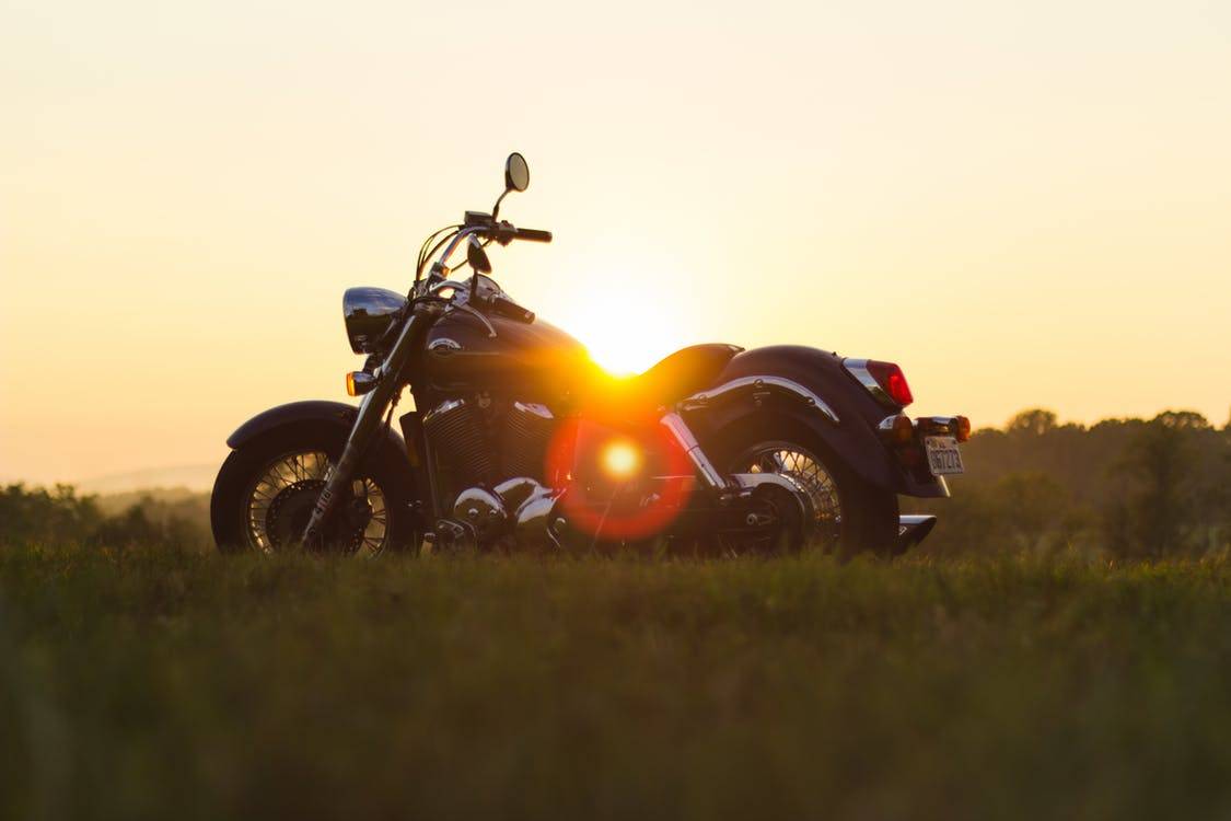 sunset motorcycle on road