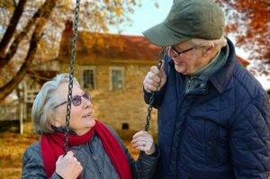 senior couple on swings