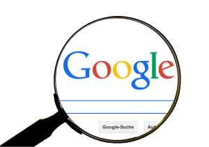 Google logo and magnifying glass